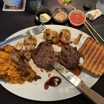 Haggerty's Steakhouse - Steak, shrimp and scallops with Texas toast and a sweet potato - New American Near Me - Roanoke Rapids, North Carolina