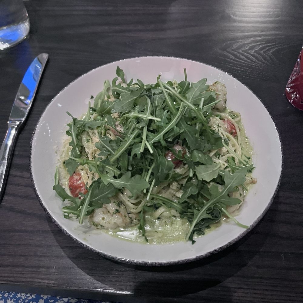 Posto - Pesto pasta with shrimp and arugula on top - Italian Near Me - Somerville, Massachusetts Posto - Pesto pasta with shrimp and arugula on top - Italian Near Me - Somerville, Massachusetts