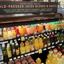 a display of cold pressed juice blends and roots a display of cold pressed juice blends and roots