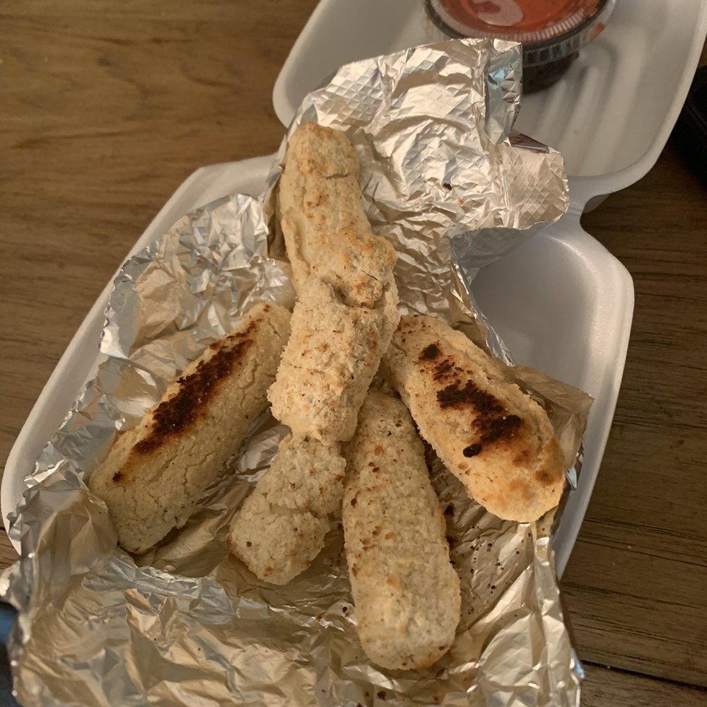 a plate of breadsticks and dipping sauce a plate of breadsticks and dipping sauce