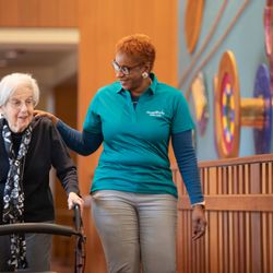 HouseWorks - HouseWorks Case Manager walking with elderly woman