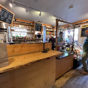 Cafe Zuri - a man standing at the counter - Coffee & Tea Near Me - Denver, Colorado Cafe Zuri - a man standing at the counter - Coffee & Tea Near Me - Denver, Colorado