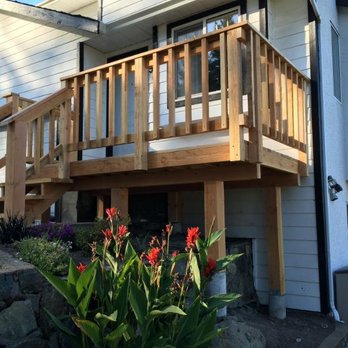 Kenergy Construction Contracting - a house with a balcony and a deck - General Contractors Near Me - Cobble Hill, British Columbia Kenergy Construction Contracting - a house with a balcony and a deck - General Contractors Near Me - Cobble Hill, British Columbia
