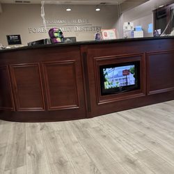 Jonathan J Yu, DDS - Forest Family Dentistry - Reception desk from waiting area.