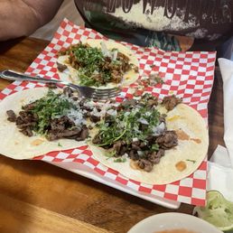 2 asada and 2 carnitas tacos