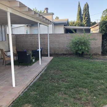 Big Green Tree Service & Landscape - After picture of vines removed on side fence (I do not have a before picture but vines covered the brick fence) - Tree Services Near Me
