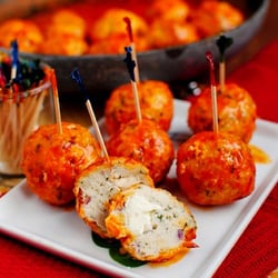 We Cater San Diego - Buffalo Stuffed Meatballs | Delicious ground turkey meatballs oozing with bleu cheese and lathered in our tangy buffalo sauce