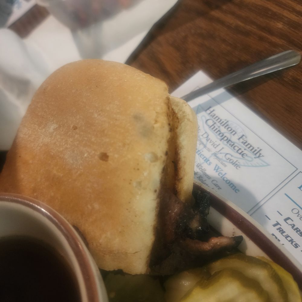 a hamburger and pickles