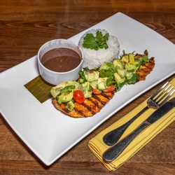 Mamajuana Cafe prime - Grilled chicken breast, Avocado salad, white rice and black beans