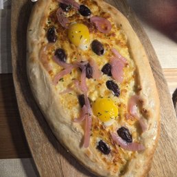 Khatchapouri with pickled onion and Kalamata olives Khatchapouri with pickled onion and Kalamata olives
