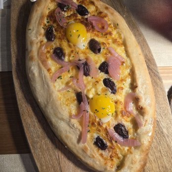 Old Town Crepes - Khatchapouri with pickled onion and Kalamata olives - Breakfast & Brunch Near Me - Myrtle Beach, South Carolina Old Town Crepes - Khatchapouri with pickled onion and Kalamata olives - Breakfast & Brunch Near Me - Myrtle Beach, South Carolina