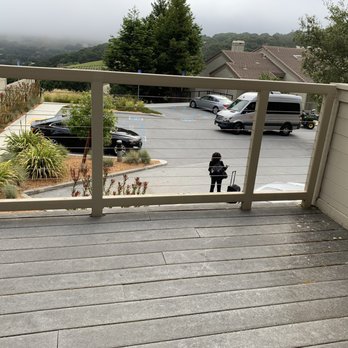 Carmel Valley Ranch - The view from our suite was actually a parking lot (!) where a shuttle picks up.  The deck had white bird droppings (see far corner). - Hotels Near Me - Carmel, California