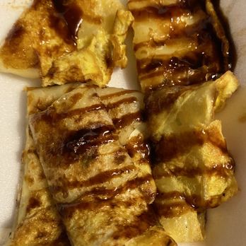 Eastside Asian Market - 1/2 of our order of the egg pancake. (Couldn't wait before we got it home) - Specialty Food Near Me - Orlando, Florida