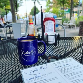 Arabella Breakfast and Brunch - A great cup of coffee on the patio at Arabella. - Coffee & Tea Near Me - Hendersonville, North Carolina Arabella Breakfast and Brunch - A great cup of coffee on the patio at Arabella. - Coffee & Tea Near Me - Hendersonville, North Carolina