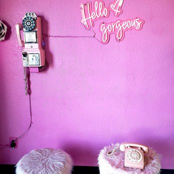 Selfie Studio Tea Lounge - a pink wall with a telephone and a pink chair - Bubble Tea Near Me - Lockeford, California