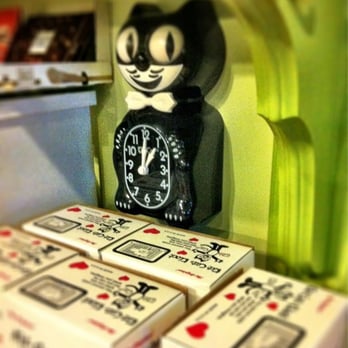 The Painted Lady Cafe - a cat clock on a shelf - Coffee & Tea Near Me - Rogers City, Michigan