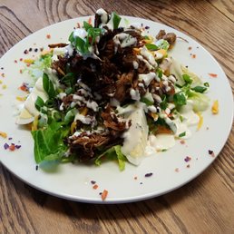 JAM DOWN CHEF SALAD Garden salad with smoked jerk pork, jerk chicken, cheddar cheese, boiled egg, ranch mango dressing