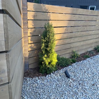 Apostle Pavers & Landscape - a bird sitting on the ground next to a fence - Landscaping Near Me - Auburn, California