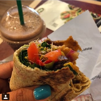 Pita Pit - customer enjoying her southwest steak pita and her smoothie! - Sandwiches Near Me - Mississauga, Ontario Pita Pit - customer enjoying her southwest steak pita and her smoothie! - Sandwiches Near Me - Mississauga, Ontario