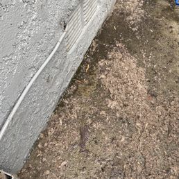 Exit point of dryer vent, lent that was removed.