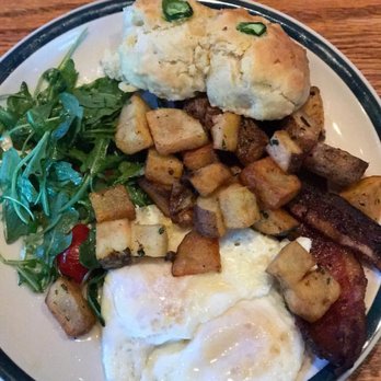 Whiskey Cake - Breakfast plate, fresh eggs, potatoes, biscuits and gravy and applewood smoked bacon with a side of greens - New American Near Me - Plano, Texas Whiskey Cake - Breakfast plate, fresh eggs, potatoes, biscuits and gravy and applewood smoked bacon with a side of greens - New American Near Me - Plano, Texas