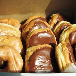 Famous Doughnuts - Cinnamon, glazed and white cream chocolate iced.
