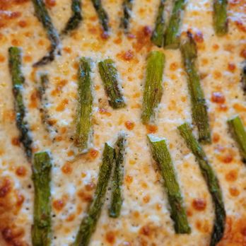 Wild Rise Pizza - Seasonal Green Goddess pizza out of oven b4 adding GG drizzle. Outstanding crust w/roasted asparagus on lemon-ricotta base w/mozzarella. - Food Delivery Services Near Me - Meridian, Idaho Wild Rise Pizza - Seasonal Green Goddess pizza out of oven b4 adding GG drizzle. Outstanding crust w/roasted asparagus on lemon-ricotta base w/mozzarella. - Food Delivery Services Near Me - Meridian, Idaho