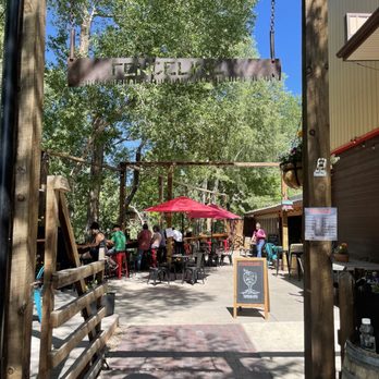 Fenceline Cider - The entry into Fenceline and the cute outdoor patio - Cideries Near Me - Mancos, Colorado