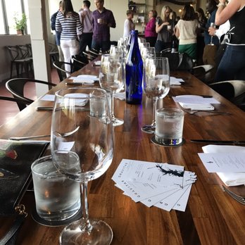 Murray Hill Club - a long table with wine glasses on it - Cocktail Bars Near Me - Washington, DC, District of Columbia