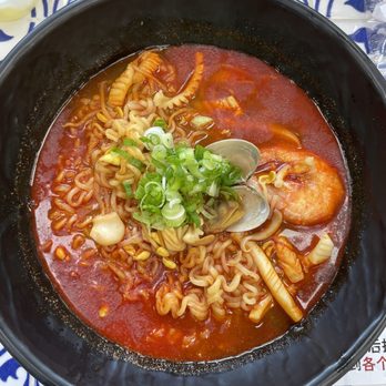 KimGaNae - Seafood Ramyun $12.  Spicy and additive broth with lots of octopus, some clams and 1 prawn. Definitely recommend this over the Seafood Udon: - Korean Near Me - Queens, New York