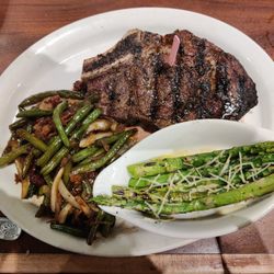 Cool Hand Luke's - Outlaw ribeye with green beans and grilled asparagus