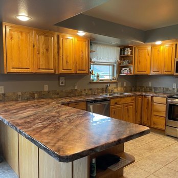 Reynoso Remodeling - a kitchen with granite countertops - Roofing Near Me Reynoso Remodeling - a kitchen with granite countertops - Roofing Near Me