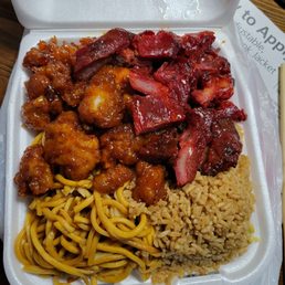 Combo C: Half fried rice and half chow mein with orange chicken and BBQ pork. Combo C: Half fried rice and half chow mein with orange chicken and BBQ pork.