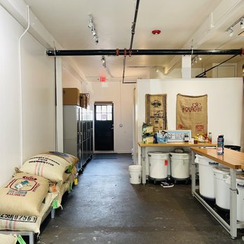 Fathom Coffee - a coffee shop with coffee bags on the floor - Coffee Roasteries Near Me - Virginia Beach, Virginia