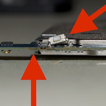 Mobile Kangaroo - Apple Authorized - Result of Mobile Kangaroo repair: Broken power button (right) and heat (?) damage to the PCB (left) - Electronics Repair Near Me - Berkeley, California Mobile Kangaroo - Apple Authorized - Result of Mobile Kangaroo repair: Broken power button (right) and heat (?) damage to the PCB (left) - Electronics Repair Near Me - Berkeley, California