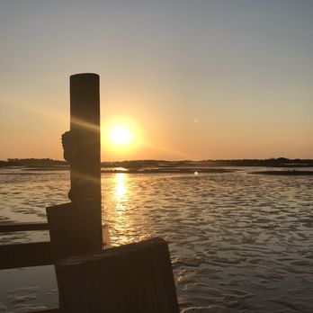 Low Key Hideaway - Sunset seated on dock hanging chairs - Bars Near Me - Cedar Key, Florida