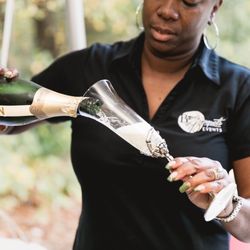 Bows & Bouquets Events - Cheryl pouring the bubbly