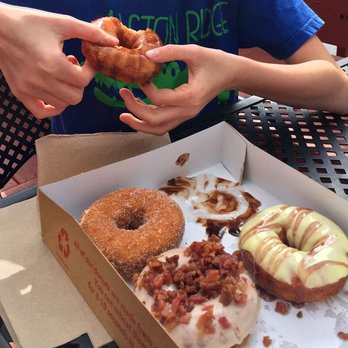 Duck Donuts - Cinnamon and sugar, maple with bacon, lemon icing with blackberry drizzle, and glazed with fudge drizzle. - Donuts Near Me - Cary, North Carolina