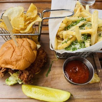 Finney's Crafthouse - Orange - Peggy's crispy chicken sandwich with large side of truffle fries - New American Near Me - Orange, California Finney's Crafthouse - Orange - Peggy's crispy chicken sandwich with large side of truffle fries - New American Near Me - Orange, California