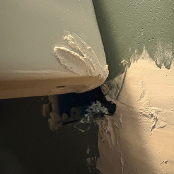 Puac Construction - Electrical outlet installed behind toilet tank and completely inaccessbile. Felipe refused to fix and left it like this. - General Contractors Near Me