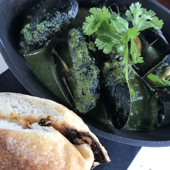 Lechon - Sautéed mussels in jalapeño miso cilantro butter - Tapas Bars Near Me - Portland, Oregon Lechon - Sautéed mussels in jalapeño miso cilantro butter - Tapas Bars Near Me - Portland, Oregon
