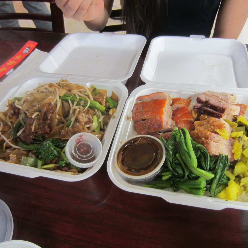 Big Wong BBQ - Beef chow fun (left) and roast duck and pig with rice and veggies (right). - Barbeque Near Me - Norcross, Georgia