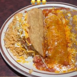 Dinner combo, chicken, taco enchilada, rice, and beans