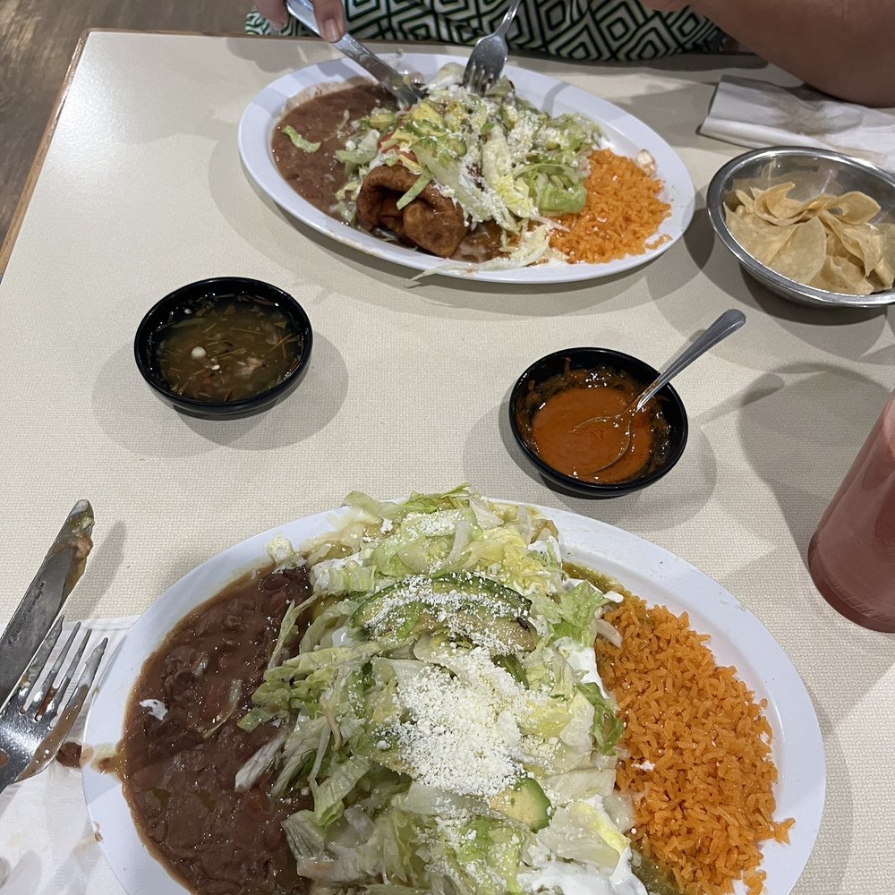 Chimichanga and green enchiladas with rice and beans with chips and salsa Chimichanga and green enchiladas with rice and beans with chips and salsa