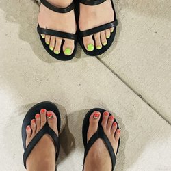 Unique Nails and Spa - My watermelon toes, and my friends bright green toes, by Kayla.