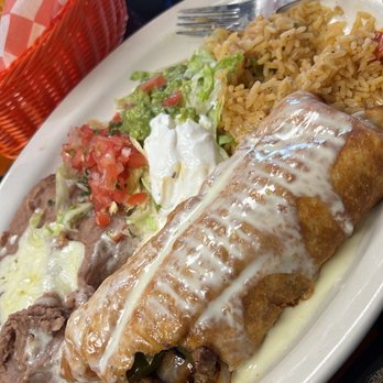 El Tapatio - Fajita beef Chimichanga I took a bite out of. Lol. - Mexican Near Me - Ardmore, Oklahoma