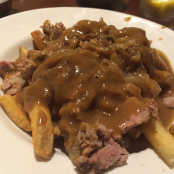 Myron's - Jewish Poutine aka The Nosher- fries, gravy, caramelized onion and chopped brisket! - Delis Near Me - Pompano Beach, Florida