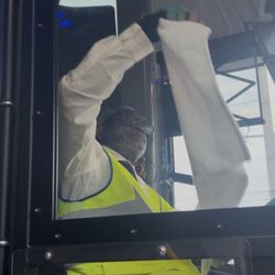 Greyhound Bus Lines - Him hiding his face