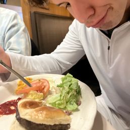 Big boy burger. Almost as big as his head!!! This is my 23 yr old brother, he's single ladies....hit his line