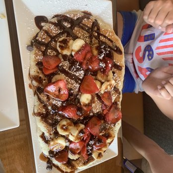 Biscuit - Chocolate chip pancakes with bananas and strawberries. - Breakfast & Brunch Near Me - Frisco, Texas Biscuit - Chocolate chip pancakes with bananas and strawberries. - Breakfast & Brunch Near Me - Frisco, Texas